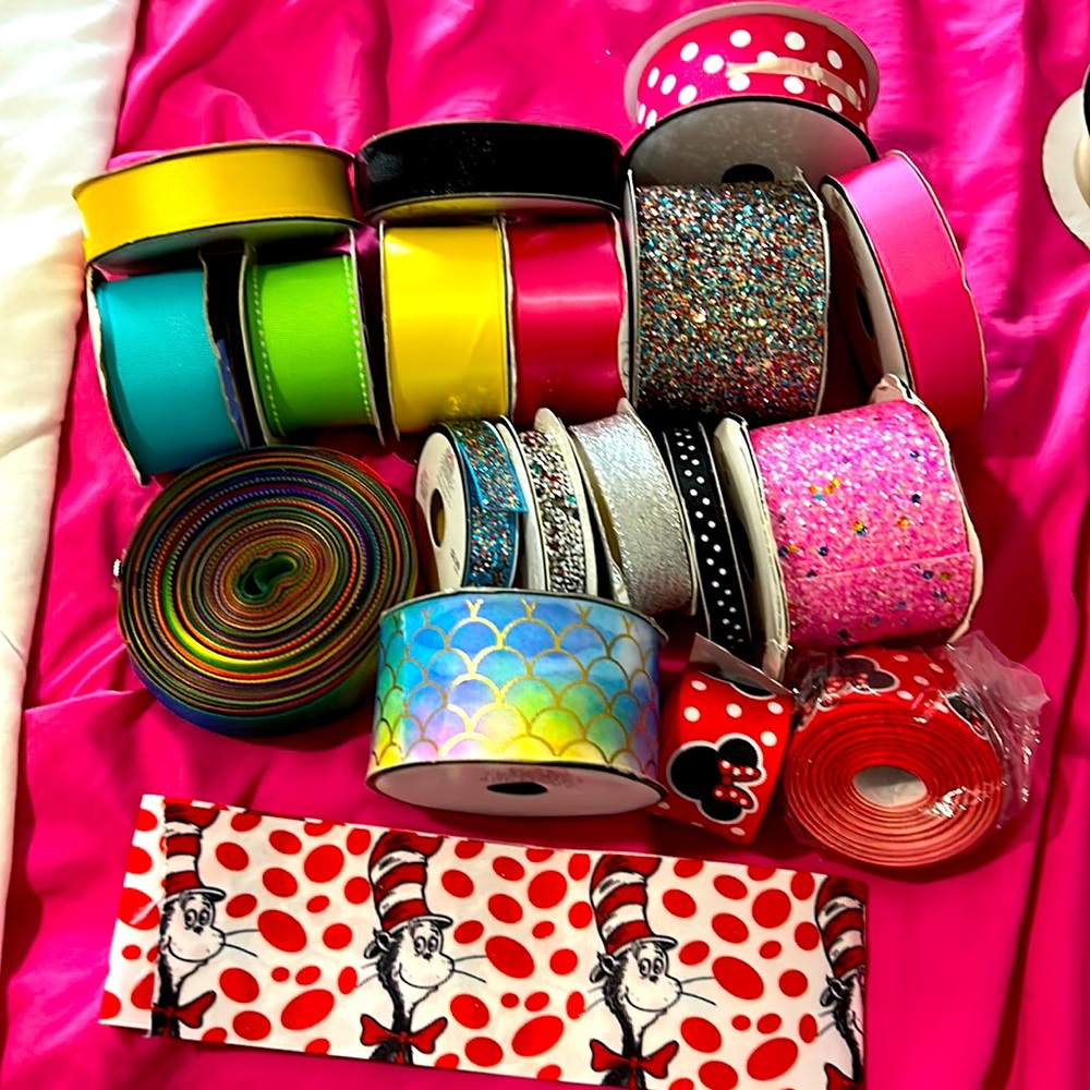 18 rolls of assorted ribbons.These have been used not sure of exact amt on each